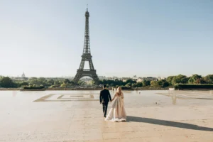 Couple walking towards the Eiffel Tower in Paris