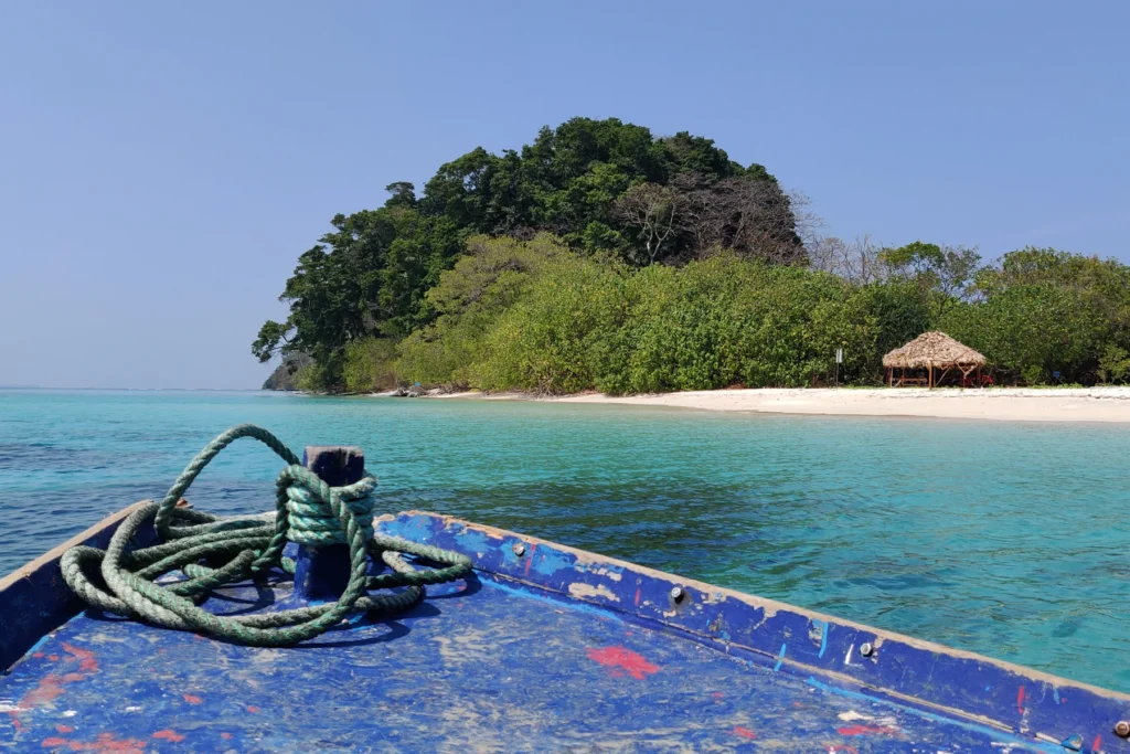 Best Time to Visit Andaman: A Month-by-Month Guide 2 Emerald water around an island in an Andaman marine park, seen from a boat