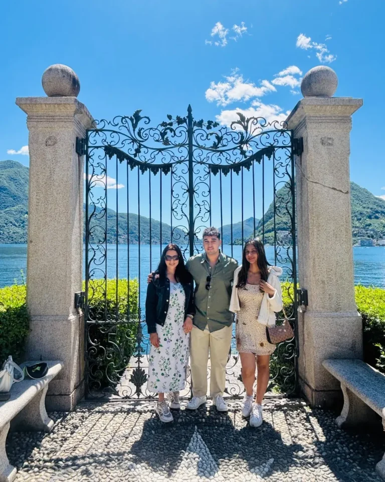 Home 14 Shiraz and family, Naviora Journeys clients, at a lakeside gate in Lugano