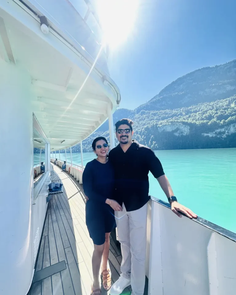 Home 4 Nikita and Mohit, Naviora Journeys clients, on a Swiss lake cruise with turquoise water and mountains