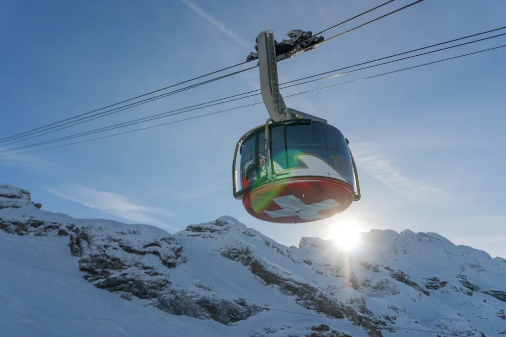 Best Time to Visit Switzerland: A Month-by-Month Guide 2 Cable car over snow above Engelberg in winter