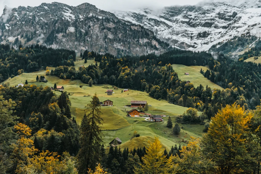 Best Time to Visit Switzerland: A Month-by-Month Guide 1 Green summer slopes and chalets on the way to Mt Titlis