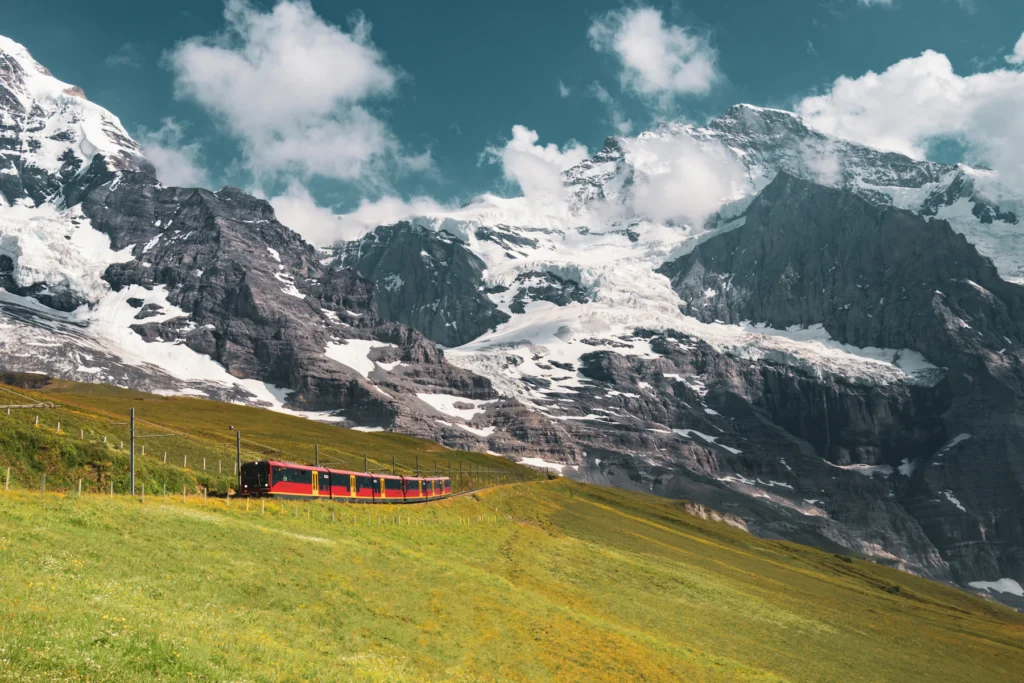 Best Time to Visit Switzerland: A Month-by-Month Guide 3 The Jungfrau Railway climbing from Kleine Scheidegg in summer
