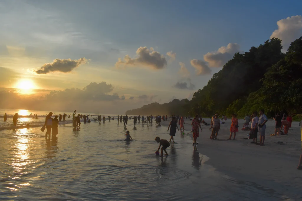 Best Time to Visit Andaman: A Month-by-Month Guide 4 Evening crowd at Radhanagar Beach, Swaraj Dweep, as the sun goes down